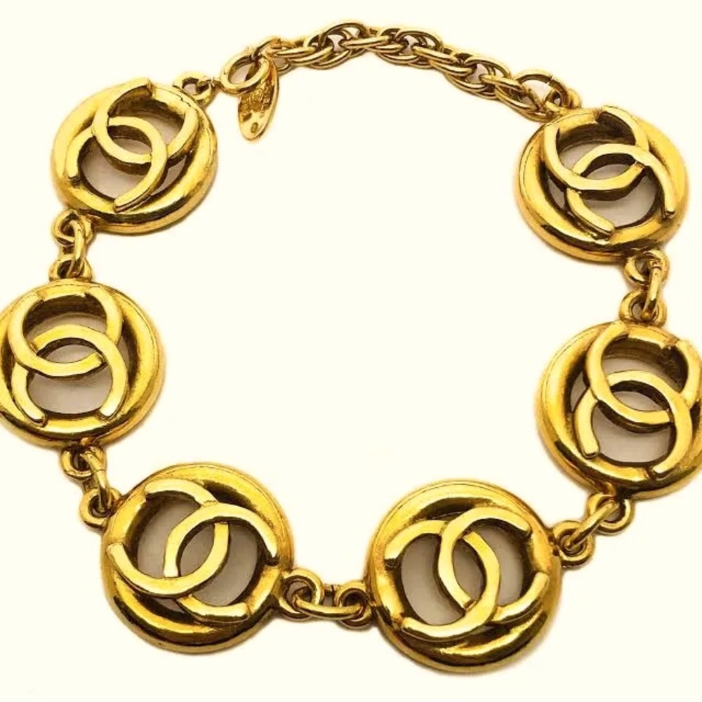 CHANEL VINTAGE RARE MULTI LOGO CHARM
BRACELET 24k Gold Plated